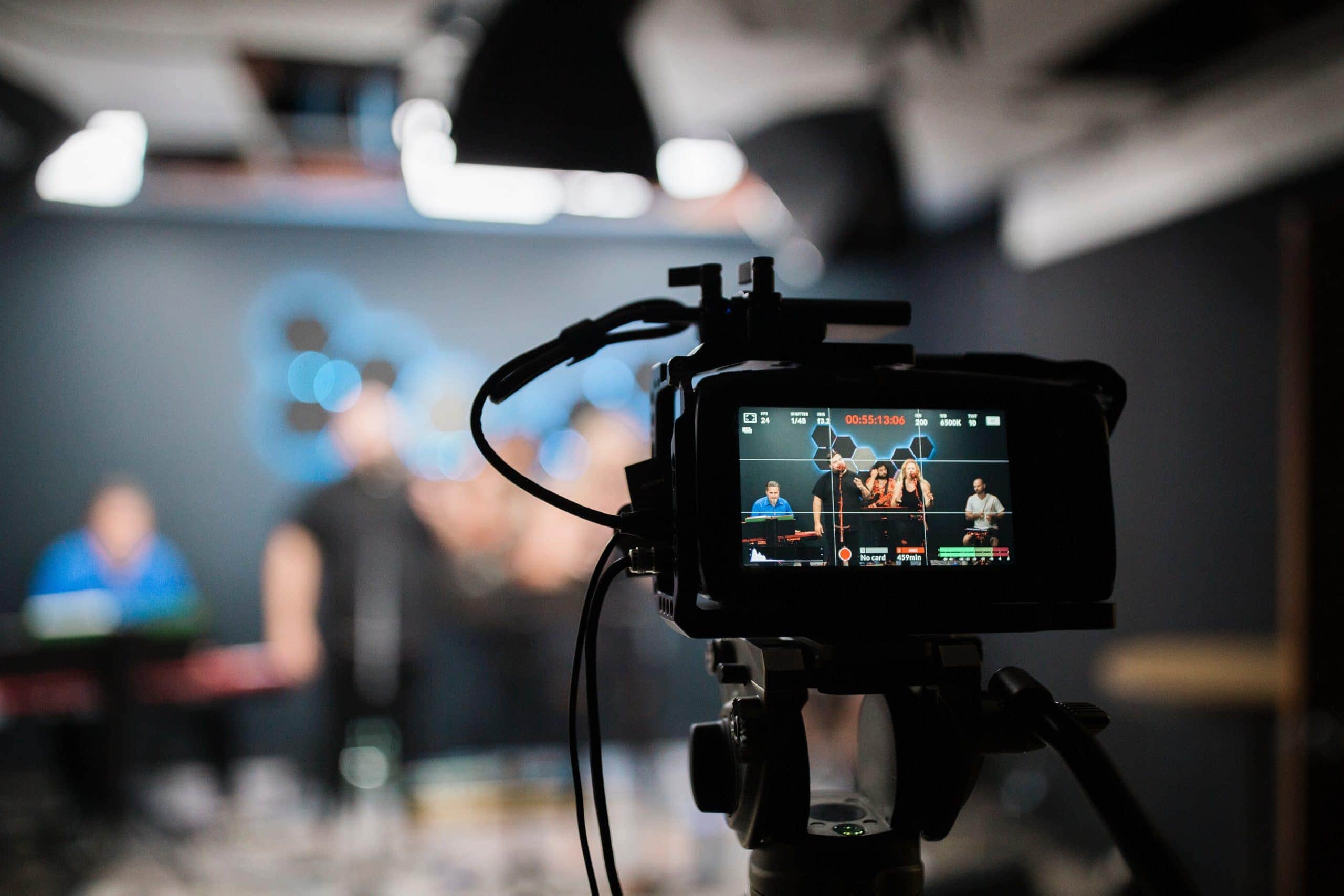 A video camera is being used in a digital church recording studio.